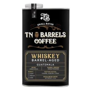 TN Barrels Coffee small batch whiskey barrel-aged Guatemala whole bean coffee can with black and gold label on a white background.