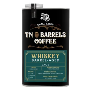 TN Barrels Coffee small batch whiskey barrel-aged Laos whole bean coffee can with black and green label on a white background.